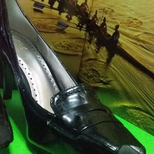 BCBG Paris black patent leather shoes.